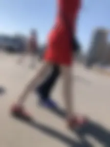 Girl in a Red Dress and Sandals With Thin, Pale Legs on the Crosswalk City Creepshots Gallery