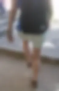 Hot ass and legs of a college teen girl entering classroom wearing shorts and a backpack closeup creepshots