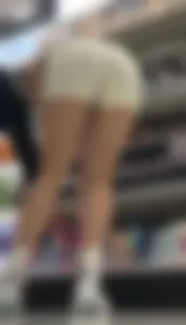 Amazing Asian in white yoga shorts upshot bends squat at Target