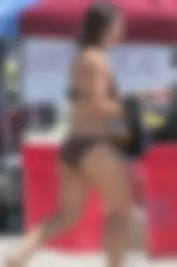 Bunch of sexy babes at the beach in bikinis