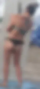 Beach shower milf in semi thong bikini with a nice ass