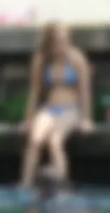 Sexy girl at the pool in a bikini with great tits