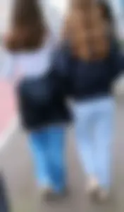 Two teens in blue jeans, one has a hot skinny ass