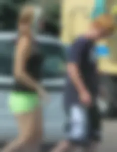 Blonde girl in glasses with a thick booty in green shorts