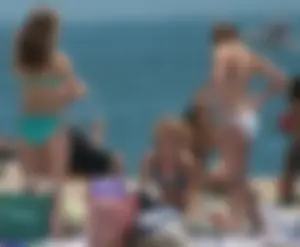 Bunch of sexy babes at the beach in bikinis
