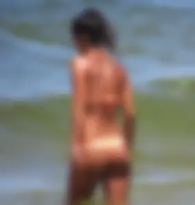 Orange thong bikini babe on the beach with a great ass