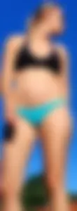 Blonde milf at the pool in small blue bikini
