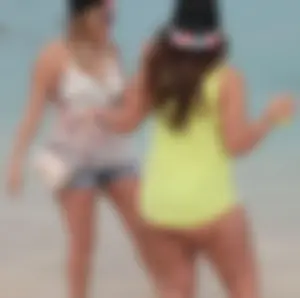 Couple PAWGs on the beach in bikinis partying