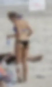 Florida blonde in blue and black bikini on the beach