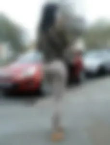 Brunette lady with a nice ass in light grey leggings walking