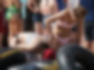 Girls in bikinis getting ready for tubing