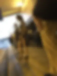 Cute Teen in Shorts on the Tram Stop