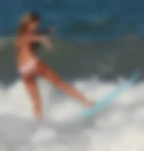 Hot surfer chicks out in the water
