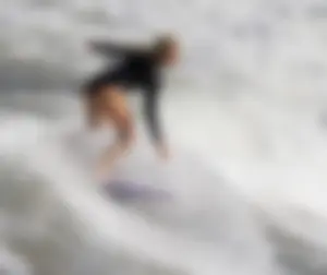 Blonde Surfer Girl in a One-Piece Swimsuit Photo Gallery