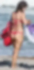 Thick brunette milf on the beach in red thong bikini