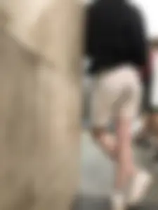 Candid Girl in Shorts and Sneakers With Very Thin Legs at the Subway Station