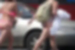 Trio of girls in bikinis on the beach and one with an incredible ass