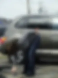 Girl cleaning her car in jeans and showing some cheetah print underwear