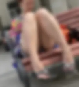 Mature Redhead in a Dress Flashing Panties While Sitting on a Street Bench