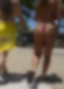 Big booty babe walking by the beach in thong