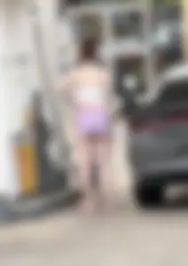 Milf with ass cheeks hanging out of her shorts at the gas station