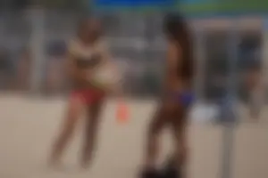 Beach volleyball babe with a nice ass in pink bikini bottom