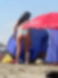Couple of thick beach teens in little thong bikinis