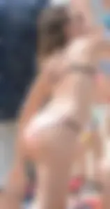 Girl in peach bikini on the beach with a great body and great ass