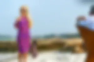 Beautiful blonde in blue thong bikini with older man exposes nipple