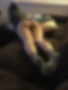 Home spy photos of candid girls' feet lying at home