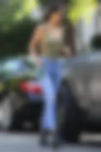 Kendall Jenner in West Hollywood with pokies and in tight jeans