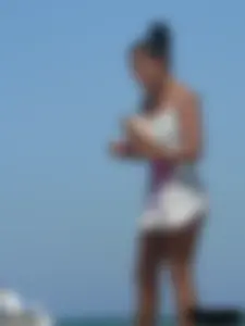 Hot ass topless beach girl with great tits lets her little brother oil up her ass in thong bikini