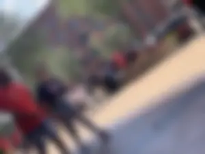 Bunch of girls in various outfits at a Cardinals baseball game