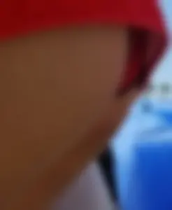 Candid beach Asian with a sexy little ass in a red swimsuit