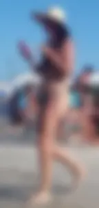 Cute girl on the beach with a decent body in thong bikini