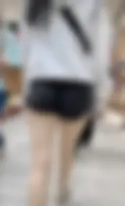 Asian girl in tight black shorts at the mall