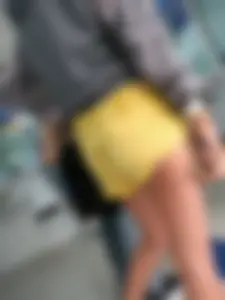 Skinny ass eating her yellow shorts