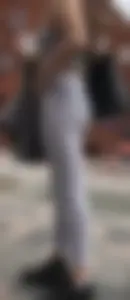 Sexy girl in see through grey leggings showing her thong
