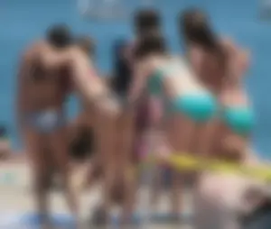 Bunch of sexy babes at the beach in bikinis