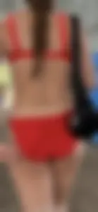 Beauty picks at her bikini wedgie