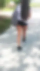 Brunette babes cheeks in tiny shorts walking