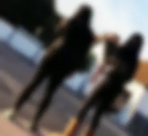 2 sexy black girls in leggings with nice asses