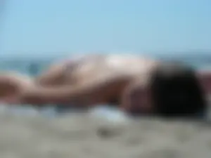 Girl with nice tits topless on the beach