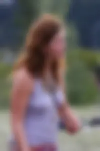 Cute hippie chick in tank top with no bra showing pokies