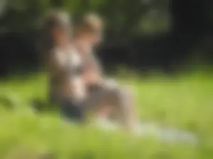 Two sexy friends in black bikinis laying out