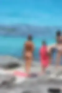Older lady on a nude beach showing her body