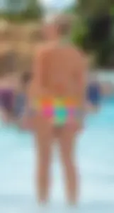 Blonde milf with a sexy body in bikini at the pool