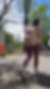 Latina with tight maroon leggings - close at end - Video