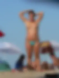 2 topless thonged sexy friends on the beach with great bodies