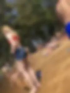 Skinny Barefoot Girl in Swimsuit and Shorts at the Beach Candid Photo Gallery